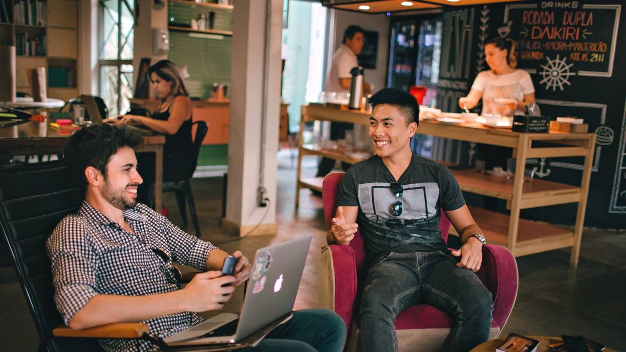 woman standing in front of multicolored wall
