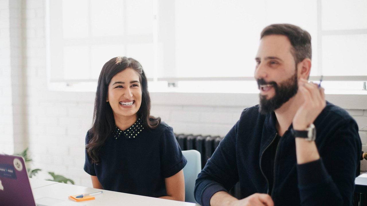 two person smiling during daytime