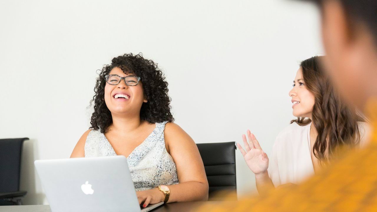 two person smiling during daytime