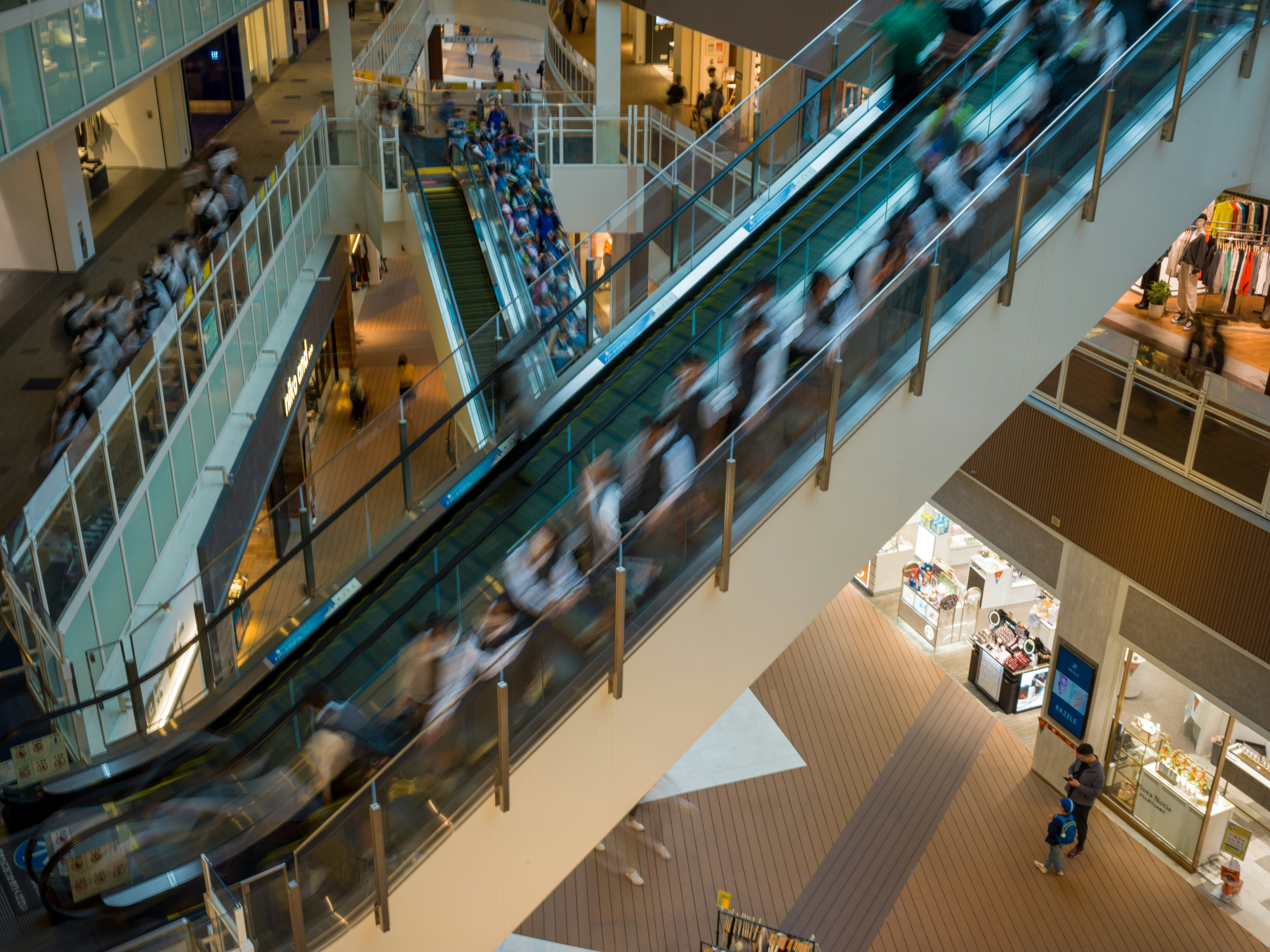 An overhead view of a shopping mall with escalators
