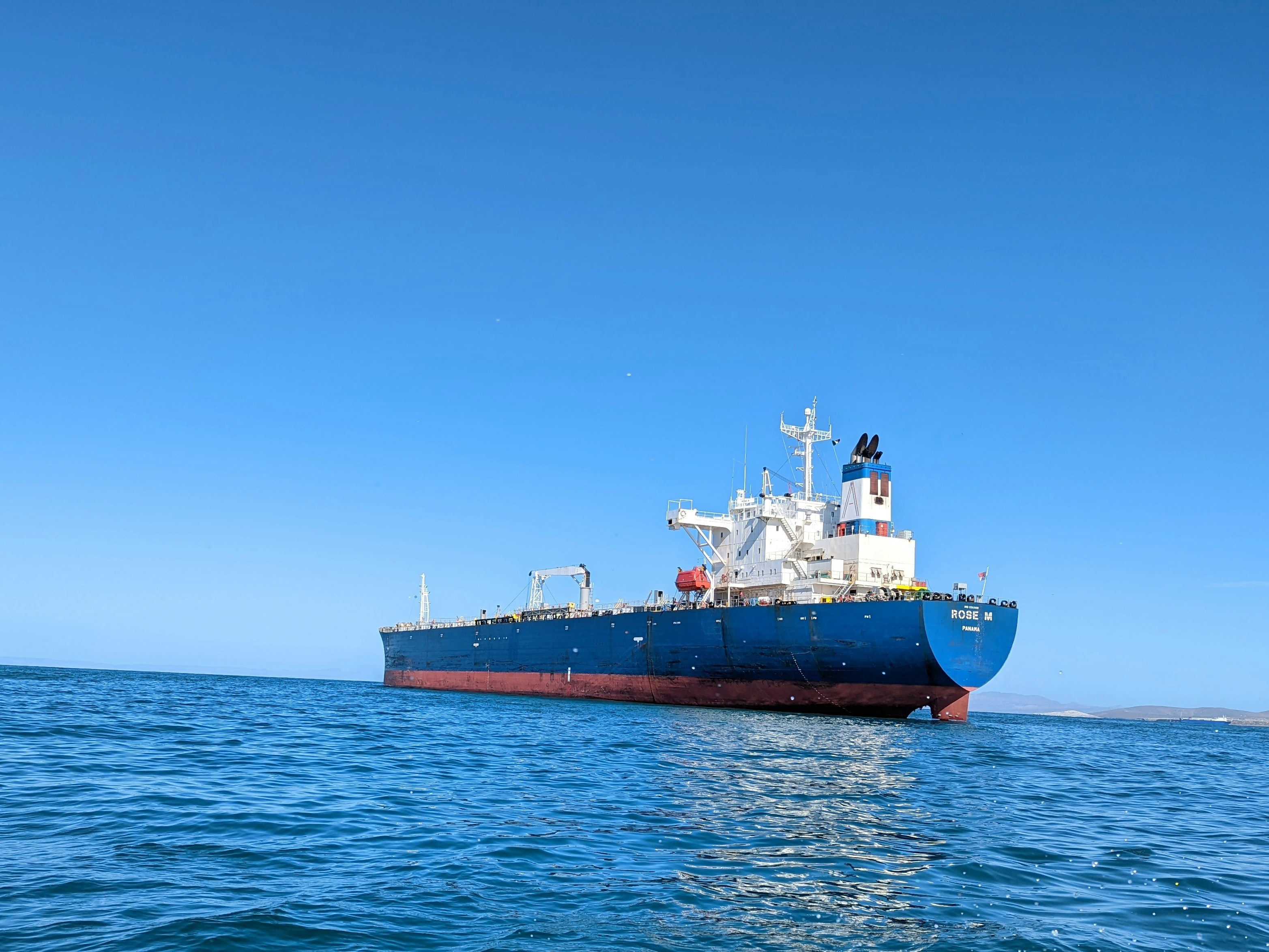 a large boat floating on top of a body of water