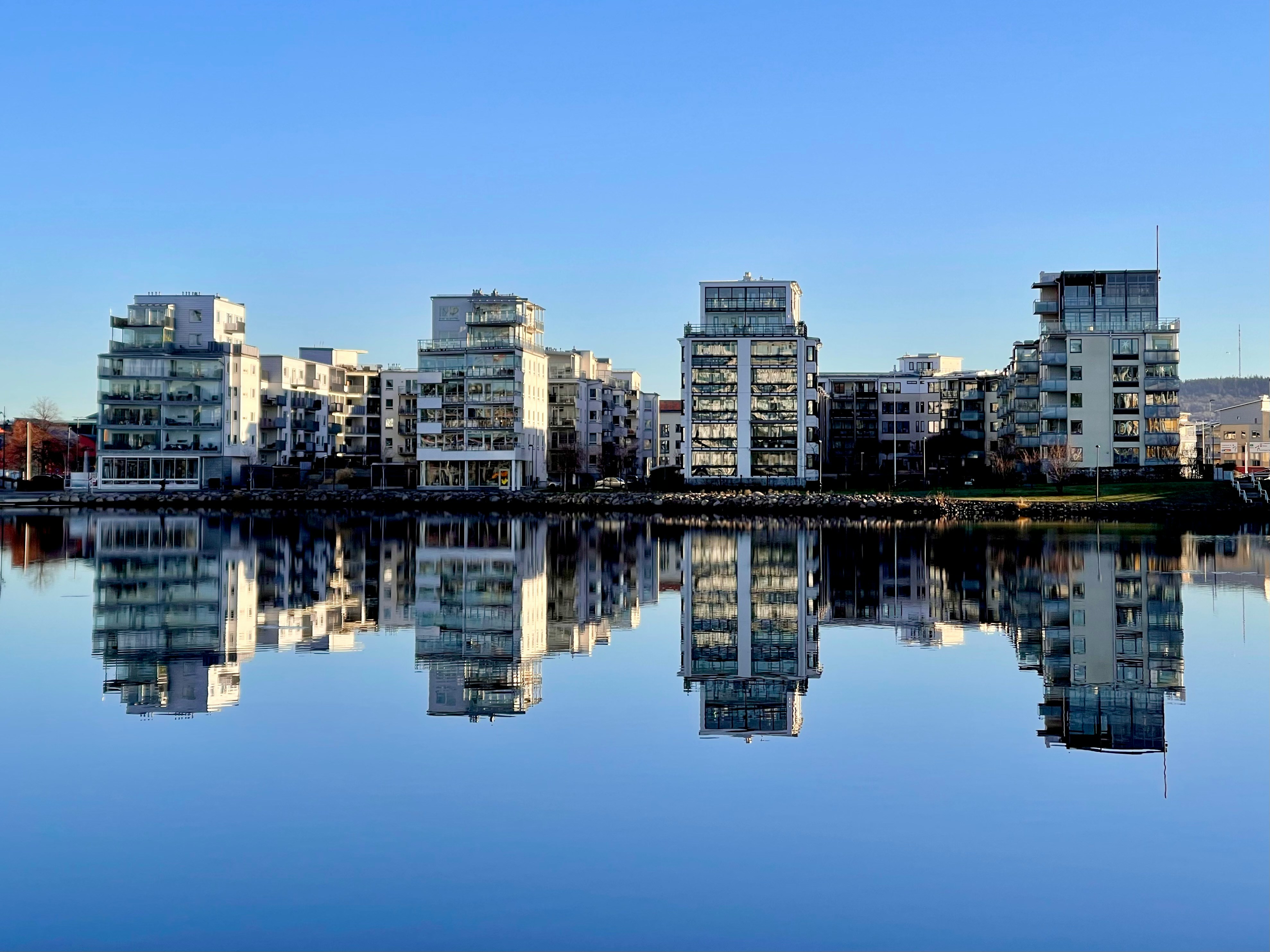 a large body of water surrounded by tall buildings