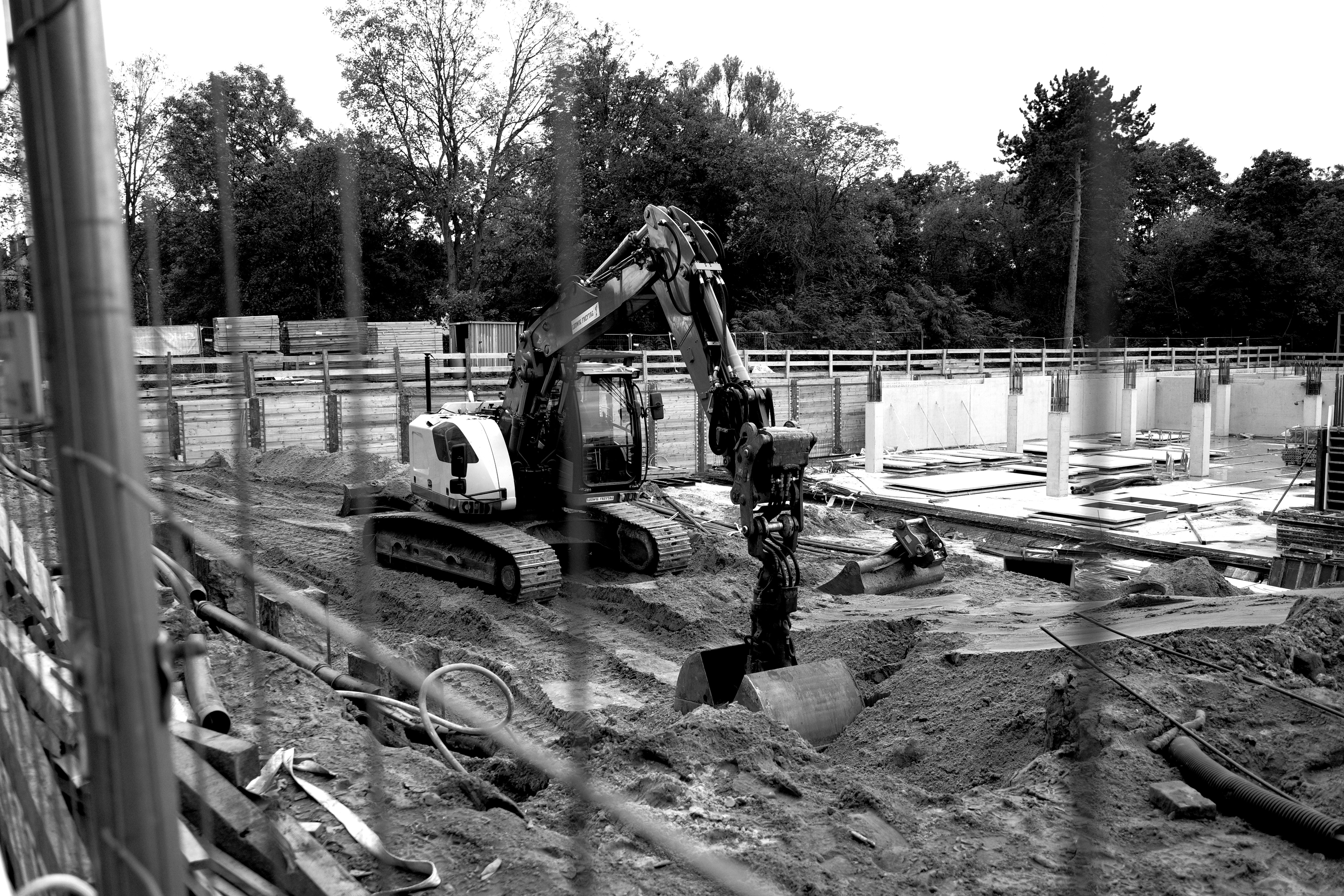 A black and white photo of a construction site