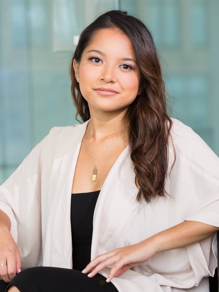 woman smiling and sitting