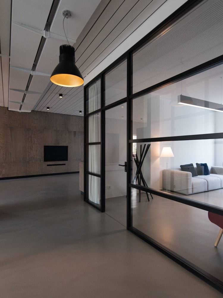 room with glass divider and white curtain