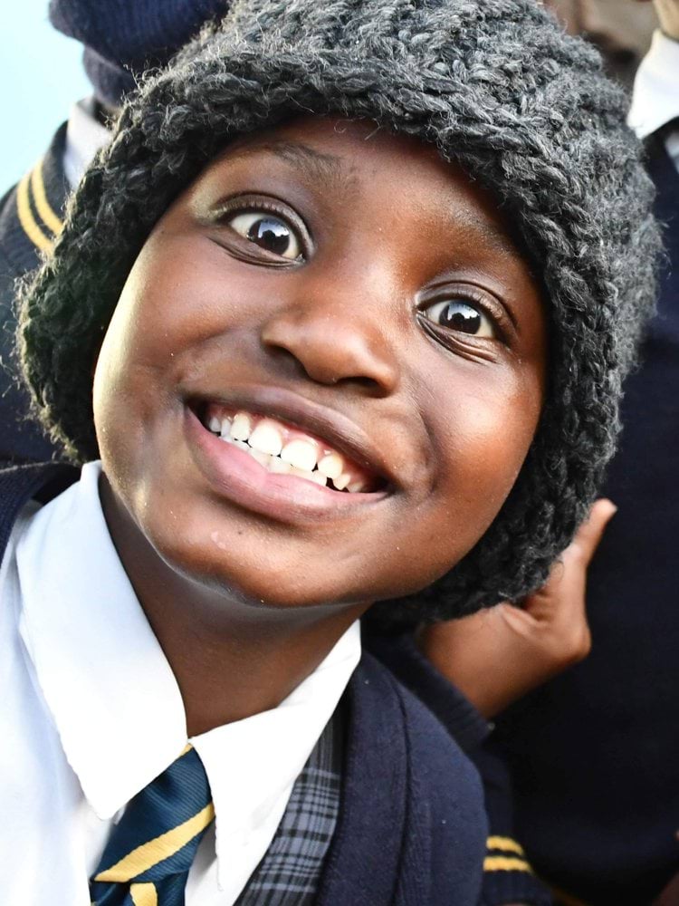 woman in black coat smiling