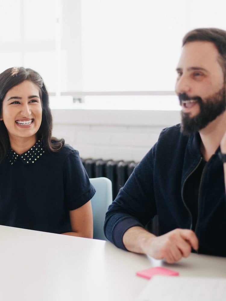 two person smiling during daytime