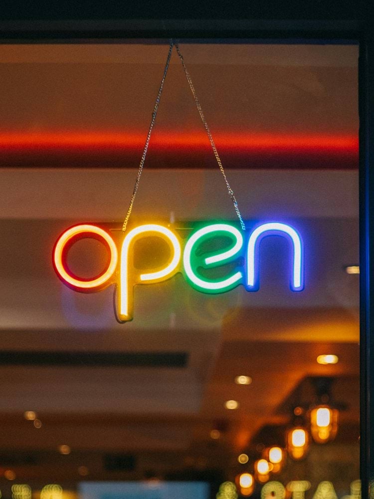 red and white open neon signage