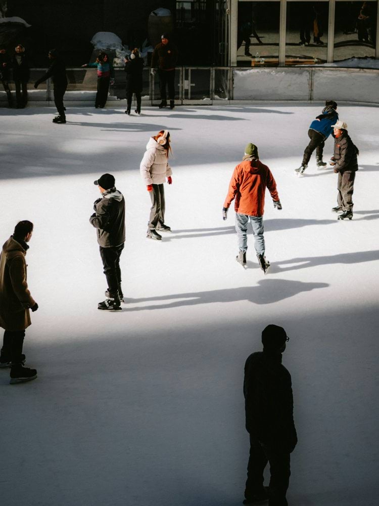 People ice skating on an outdoor rink