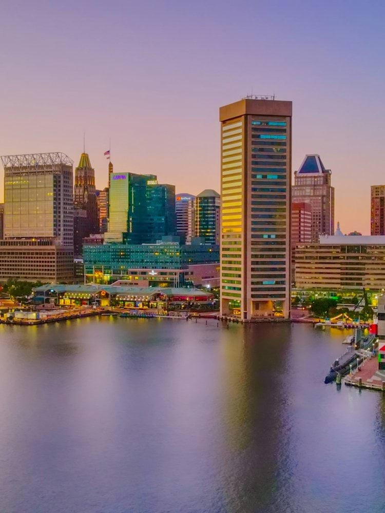 city skyline across body of water during daytime