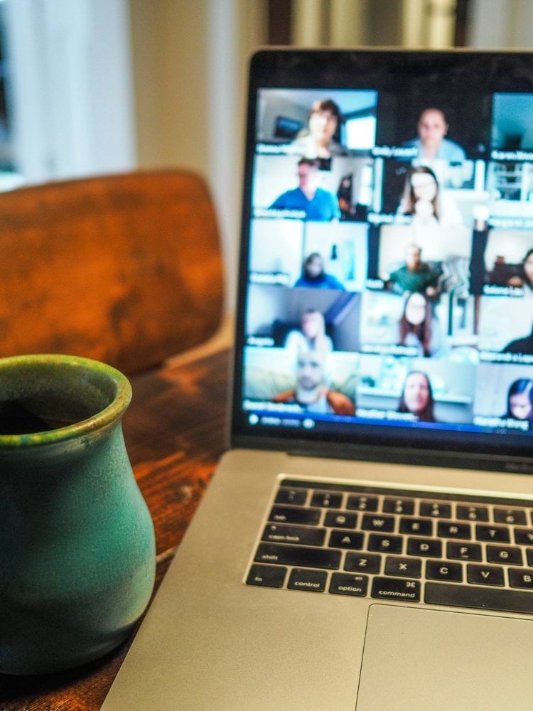 macbook pro displaying group of people