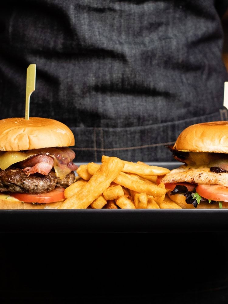 hamburgers and fries on tray
