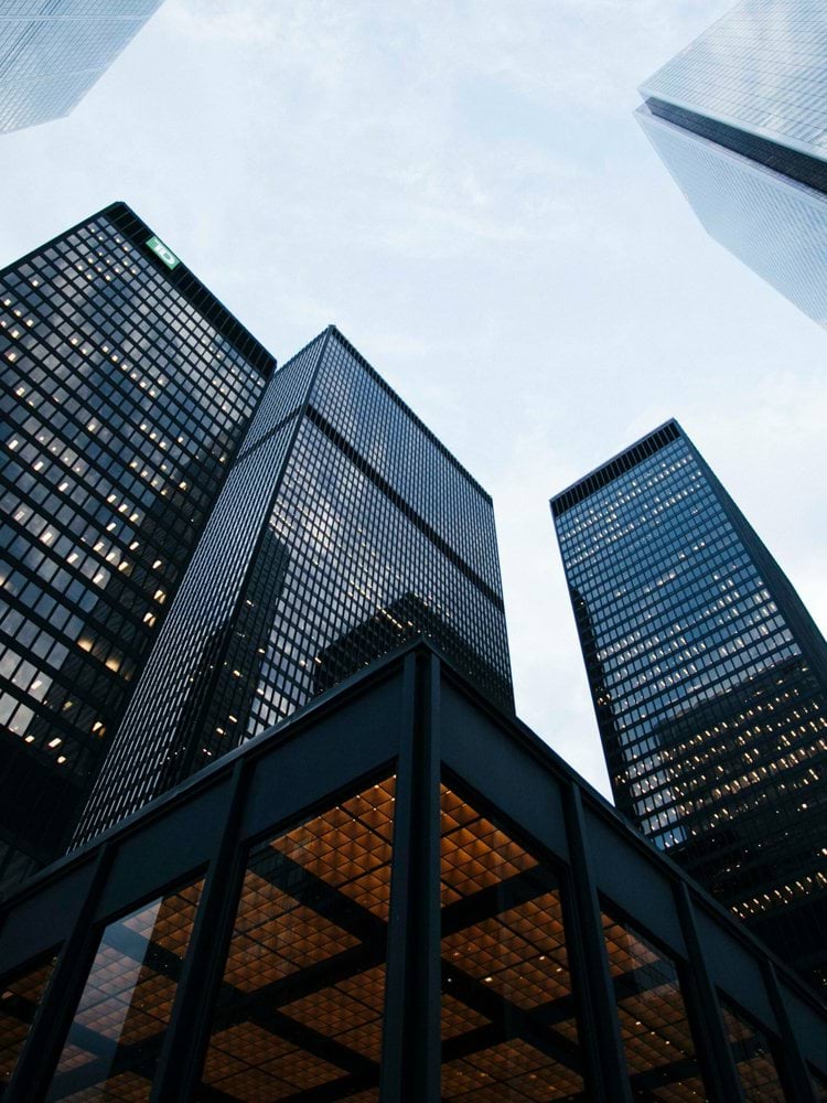 low angle photo of city high rise buildings during daytime