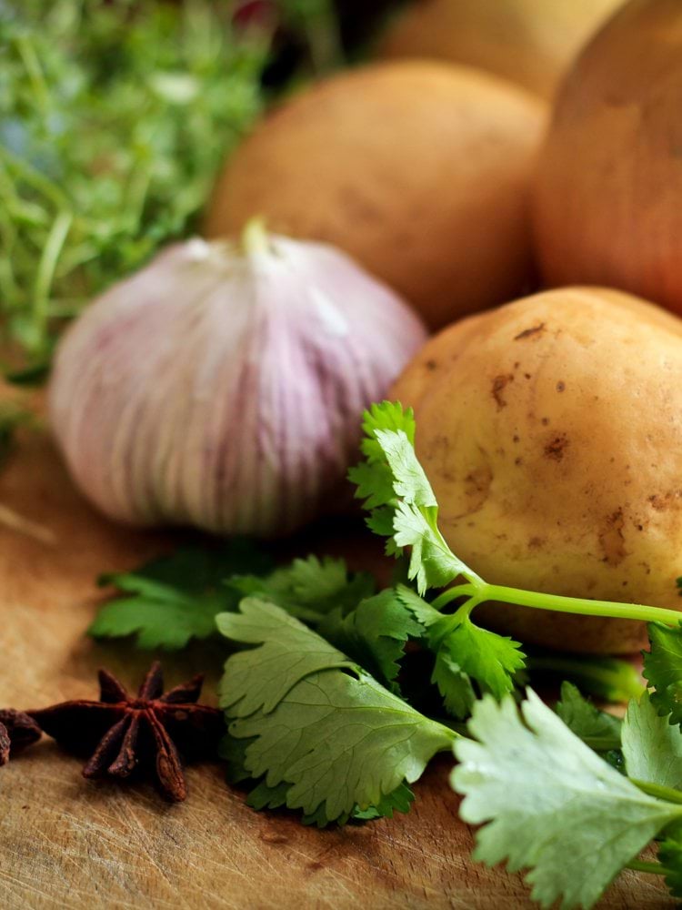 onions and potato on table