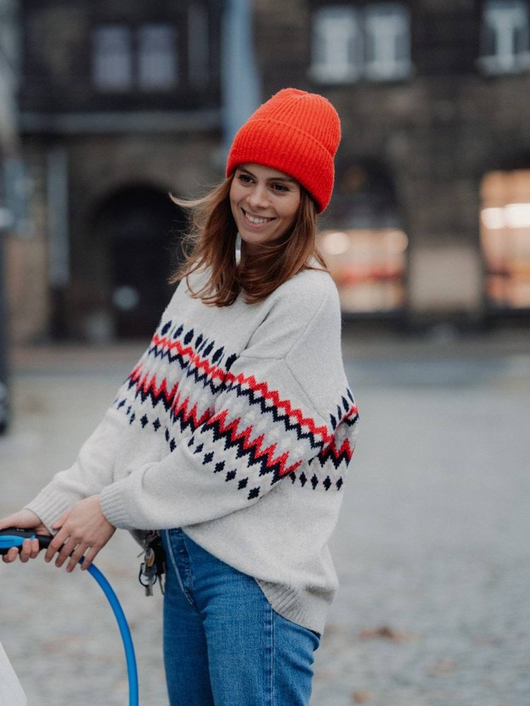 Jenny Ueberberg charging a Tesla Model 3.  