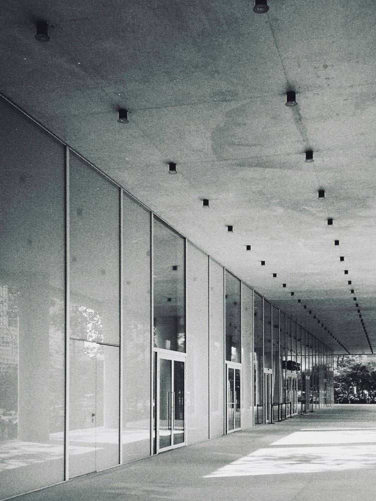 a black and white photo of a long hallway