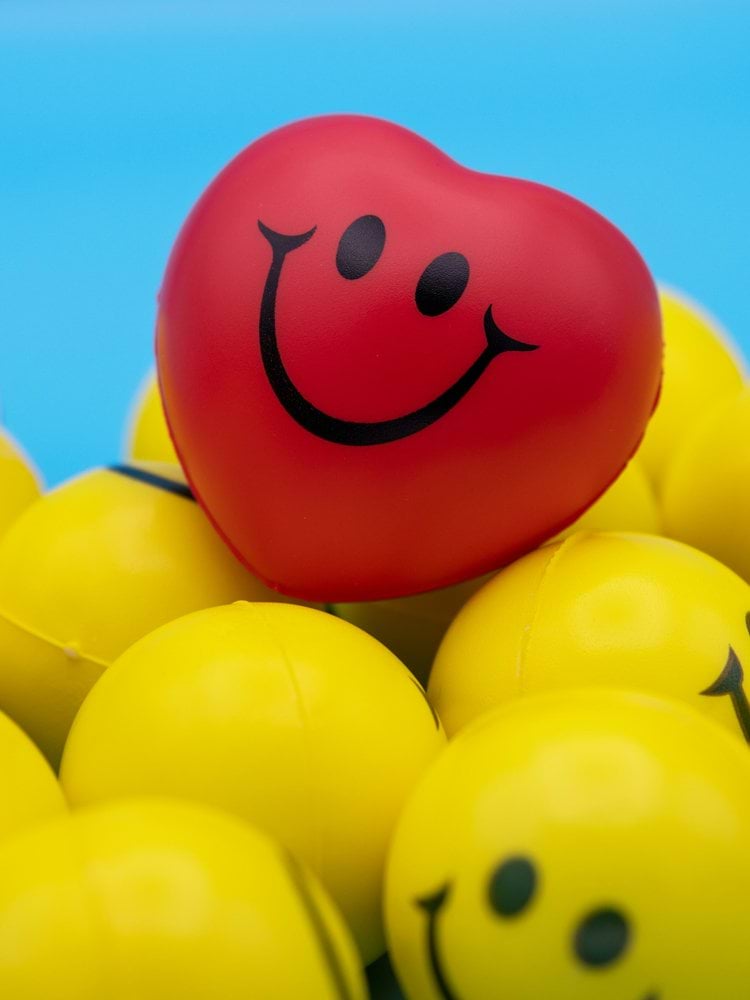 red and yellow smiley balloon
