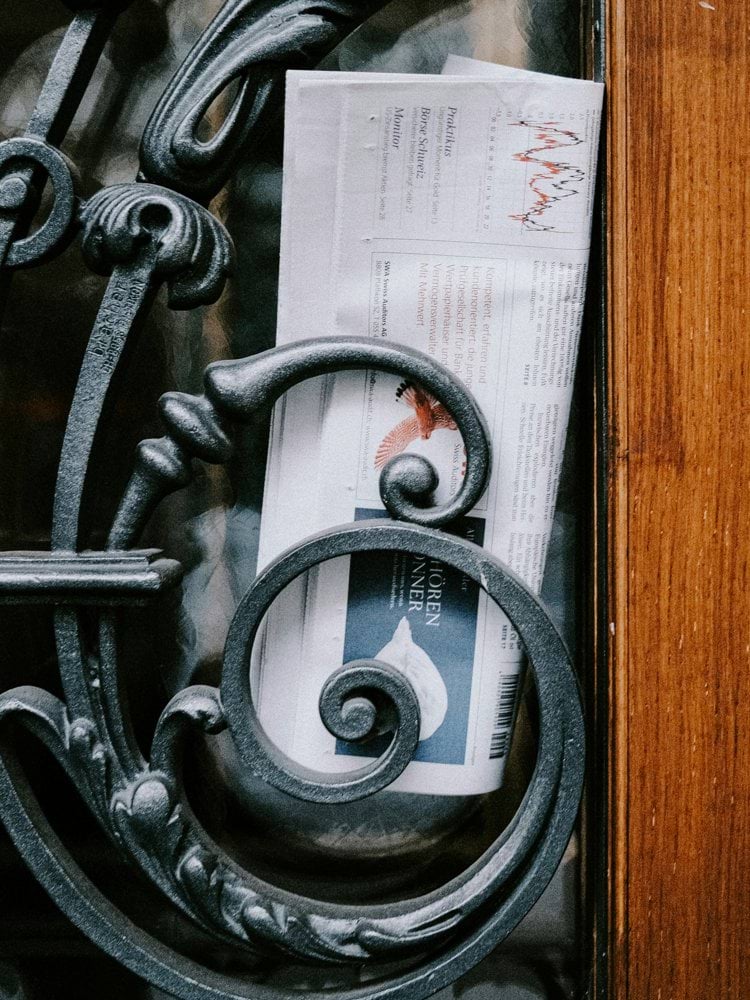 a piece of paper sitting on top of a wooden door