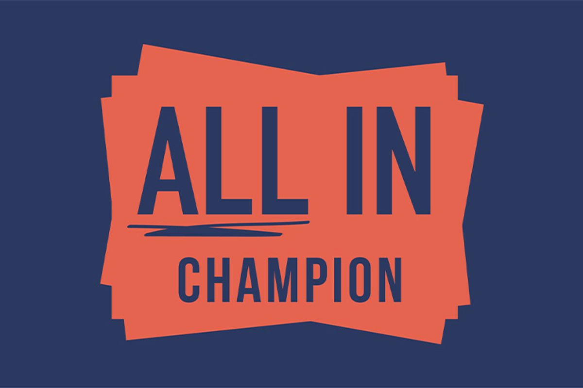 All In Champion logo with bold navy text on an orange layered background.