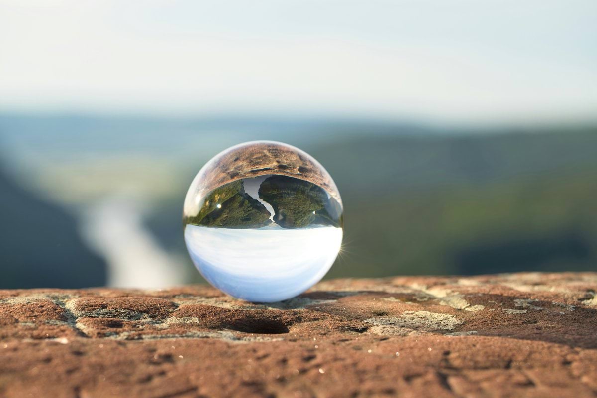 clear marble on brown rock