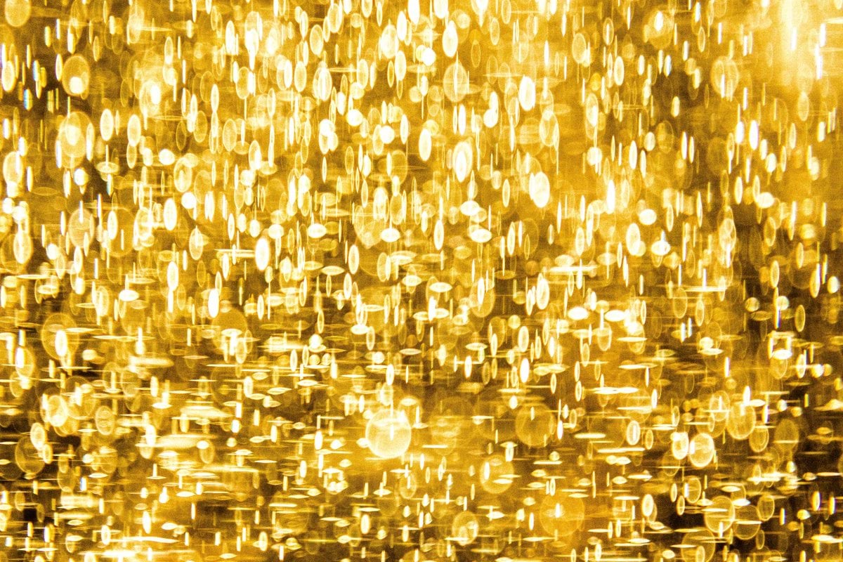 a yellow background with lots of small circles