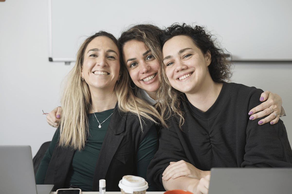 SD Worx professionals smiling together at the office