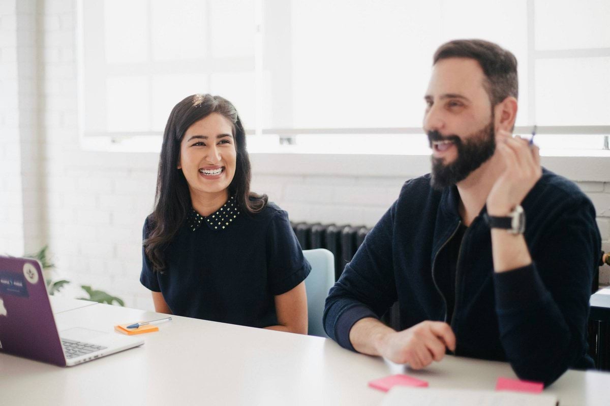 two person smiling during daytime