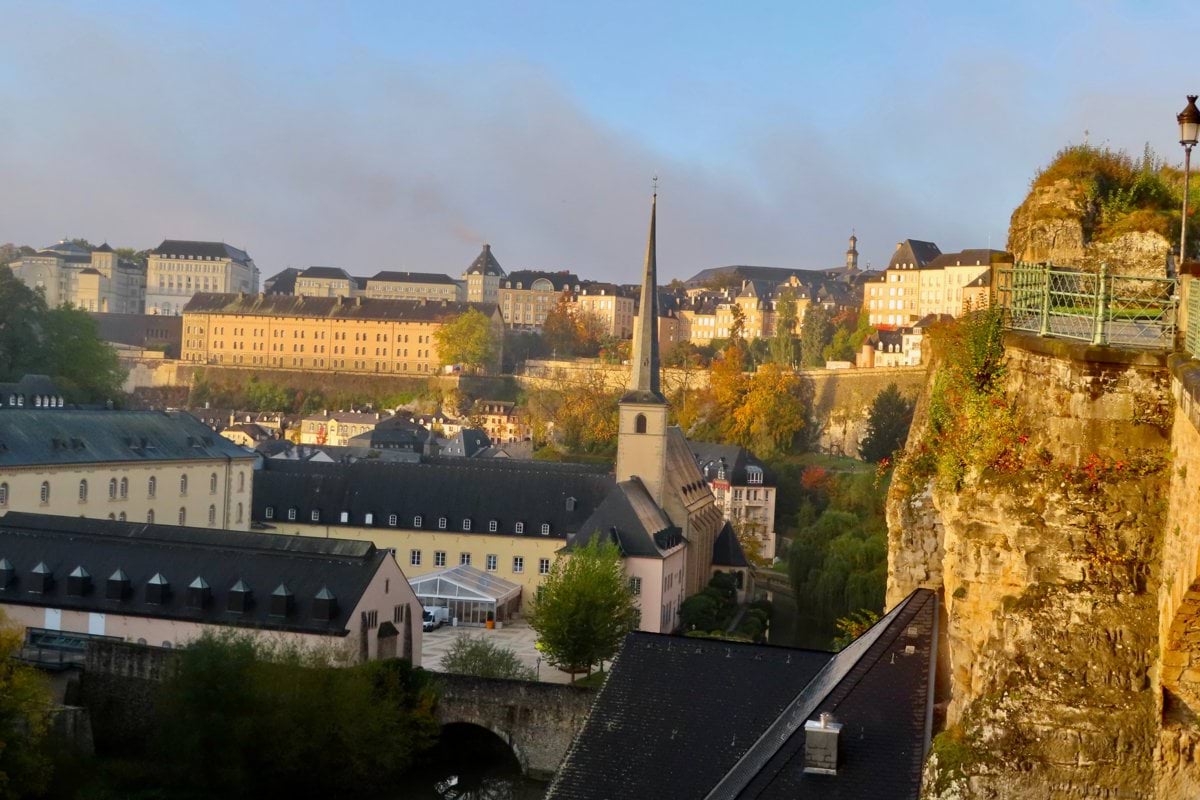a view of a city from a high cliff