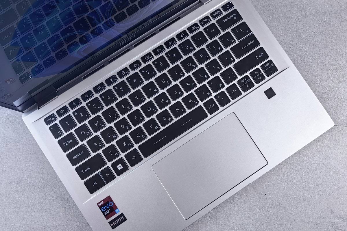 an open laptop computer sitting on top of a table