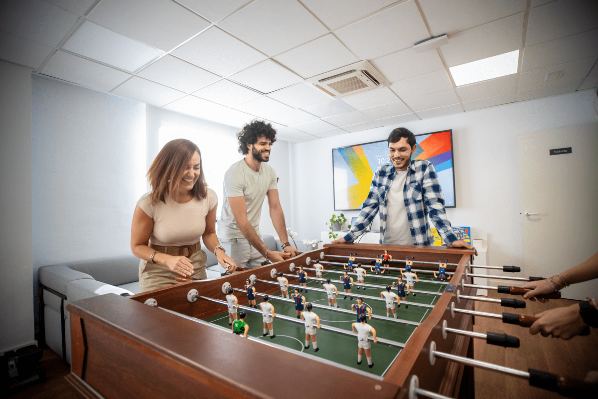 sd worx employees enjoying their break by playing table football