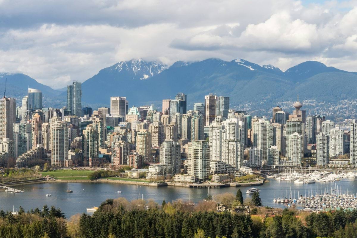 A view of a city with mountains in the background