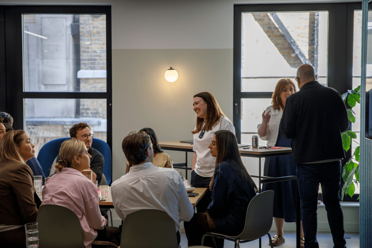Superscript team members in a all-company meeting