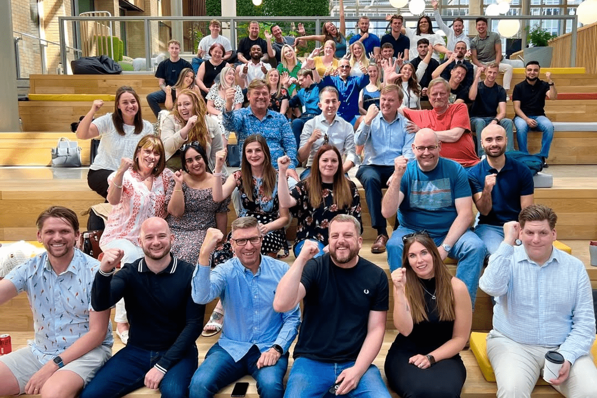 Apprentify colleagues posing for a group photo during a celebration day for the company