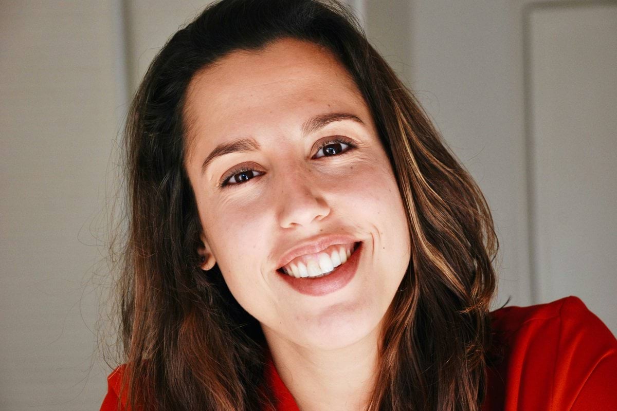 woman in red shirt smiling