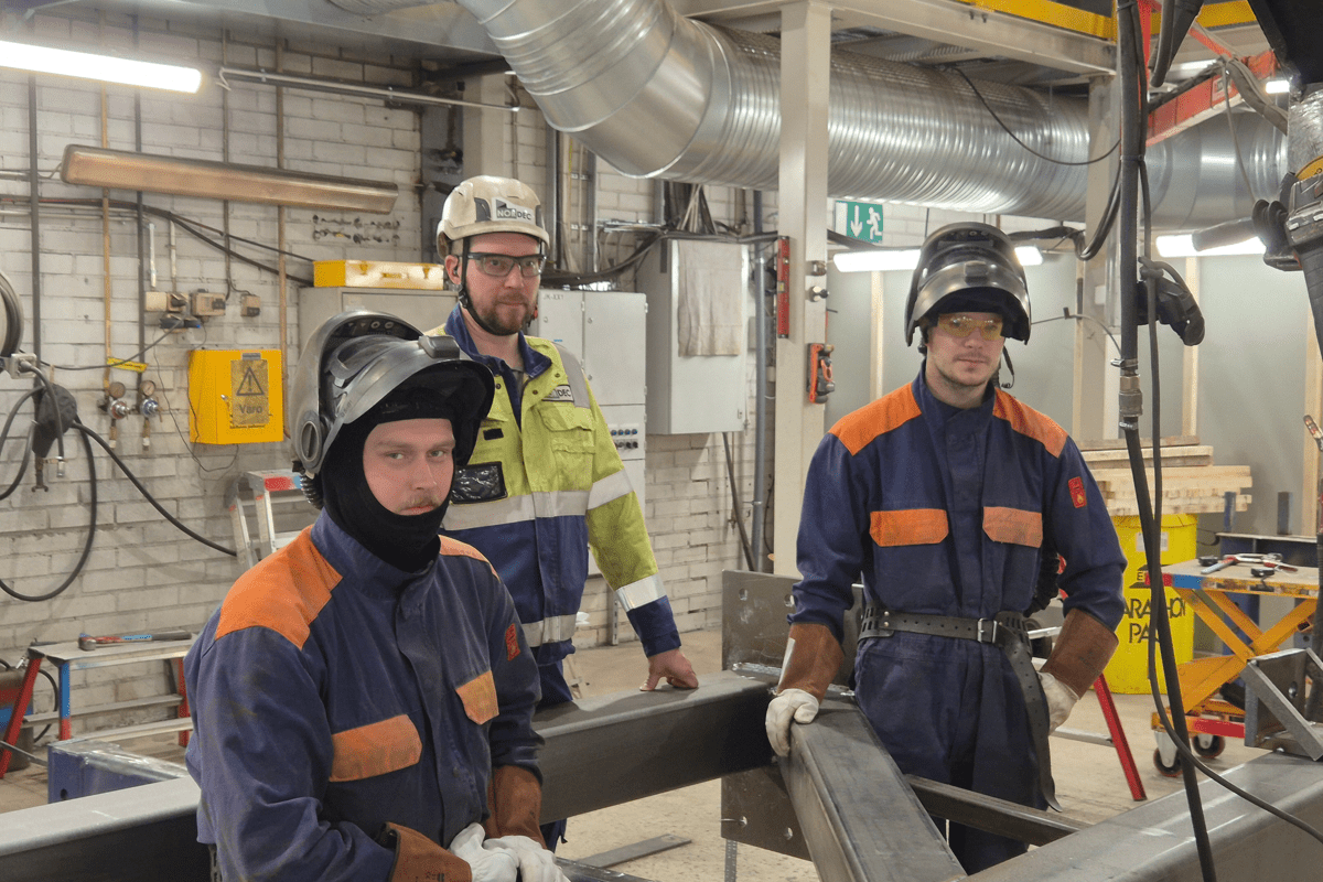 Three production employees on the production floor