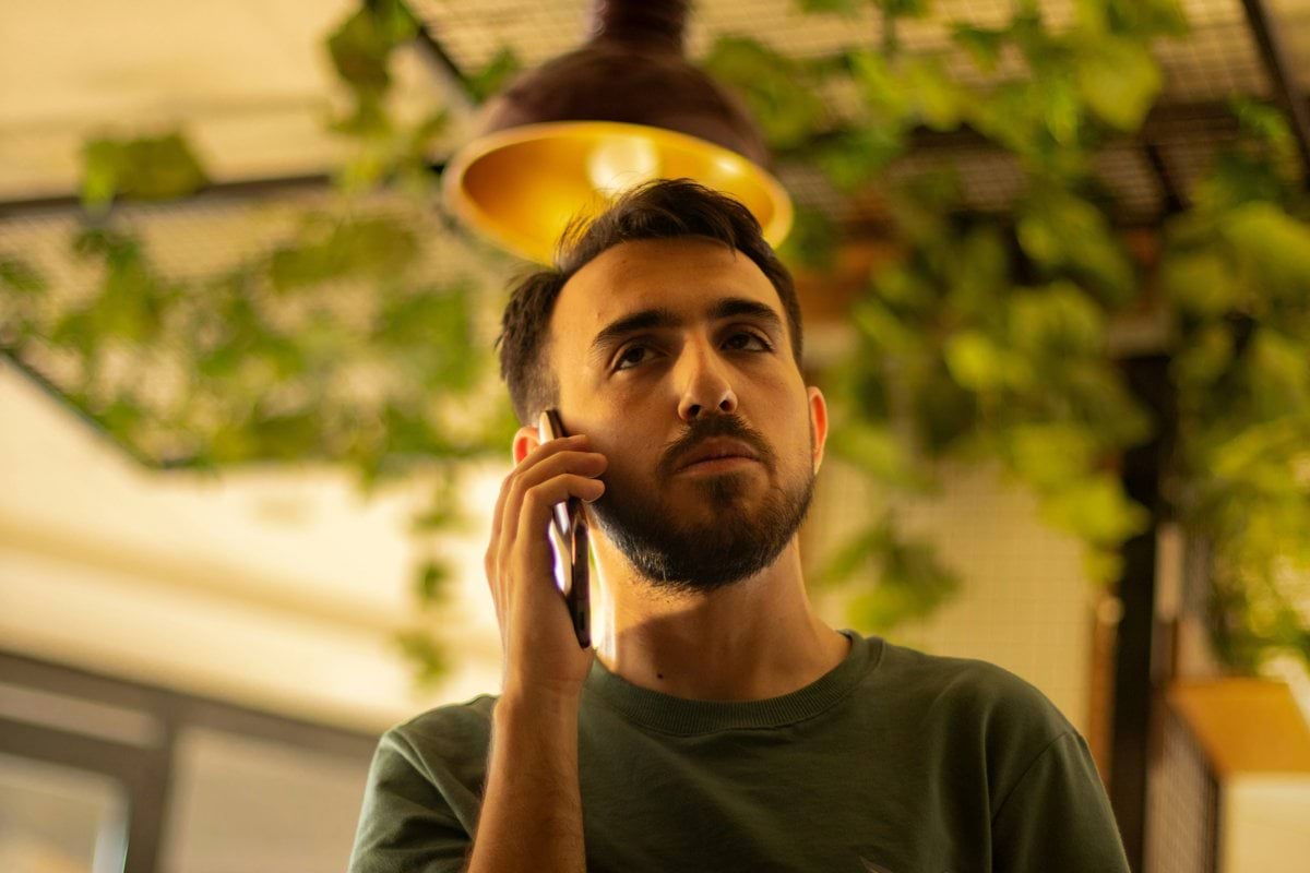 A man is talking on his cell phone