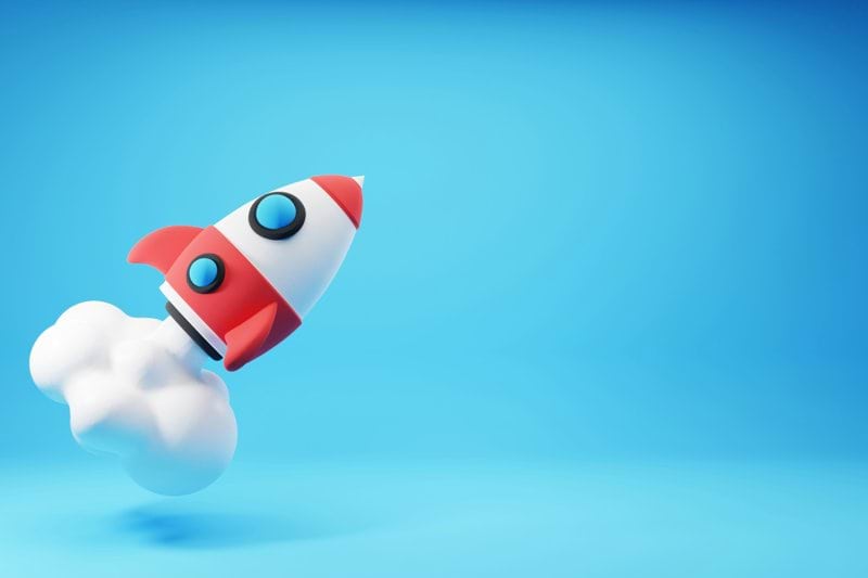 a red and white rocket ship flying through the sky