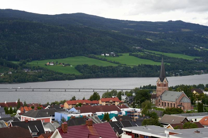 A view of a town with mountains in the background