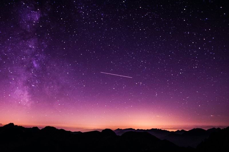 silhouette photo of mountain during night time