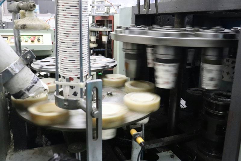 a machine making cheese in a factory