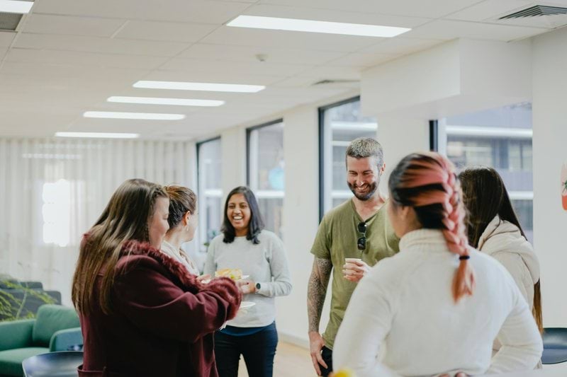 a group of people standing in a room