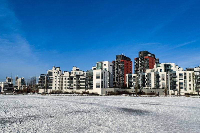city buildings near body of water during daytime