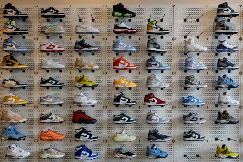 a display of various shoes on a wall