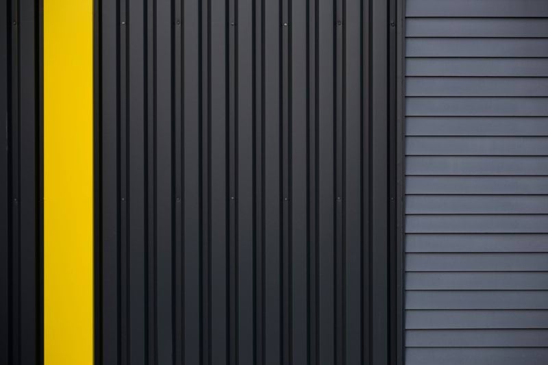 a black and yellow door with a yellow stripe