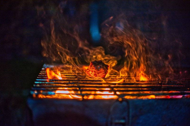 fire on black charcoal grill