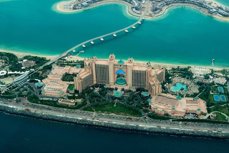 aerial photography of concrete buildings on the middle of the sea