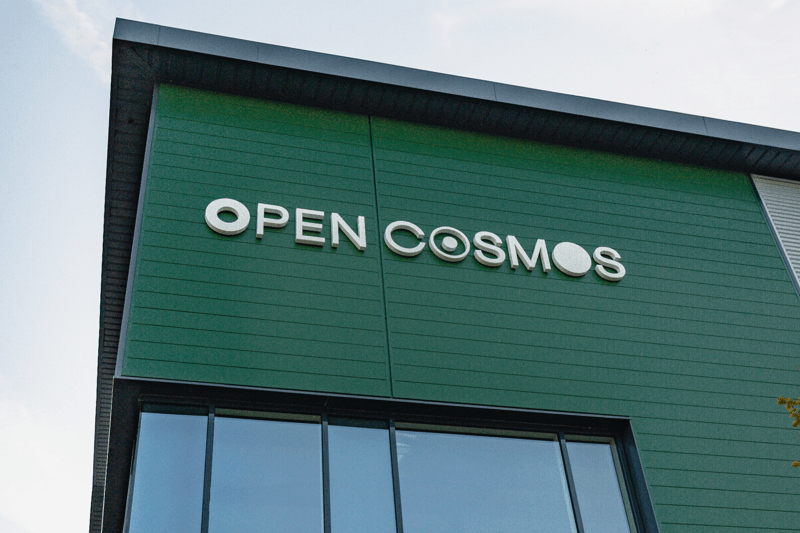 Building front with Open Cosmos Logo