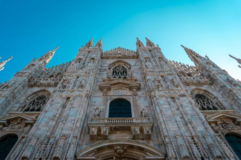 a very tall building with a clock on it's side