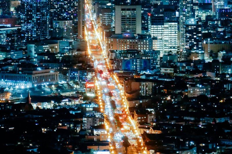 a city at night with lots of traffic