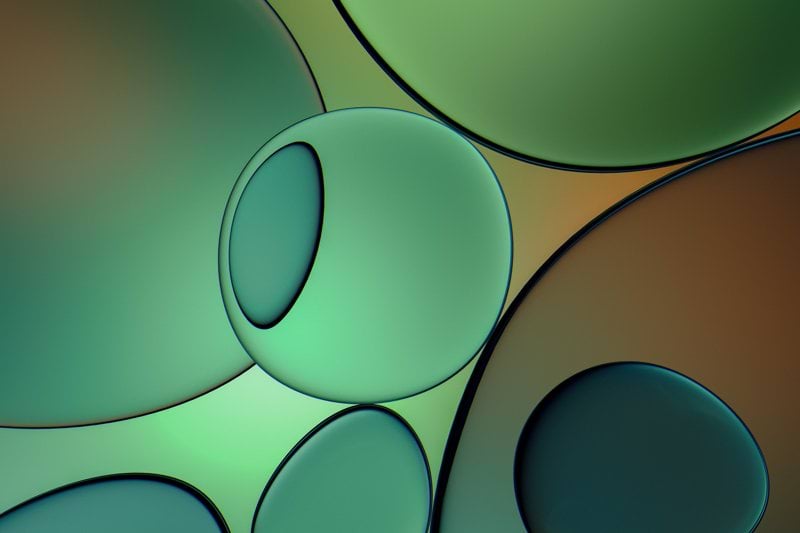 a close up of a cell phone with bubbles